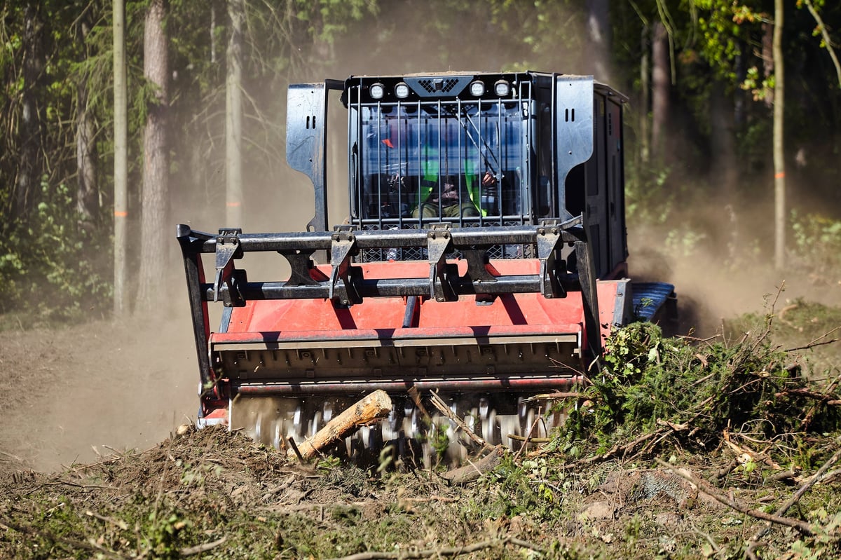 Forestry mulcher machine working on overgrown land